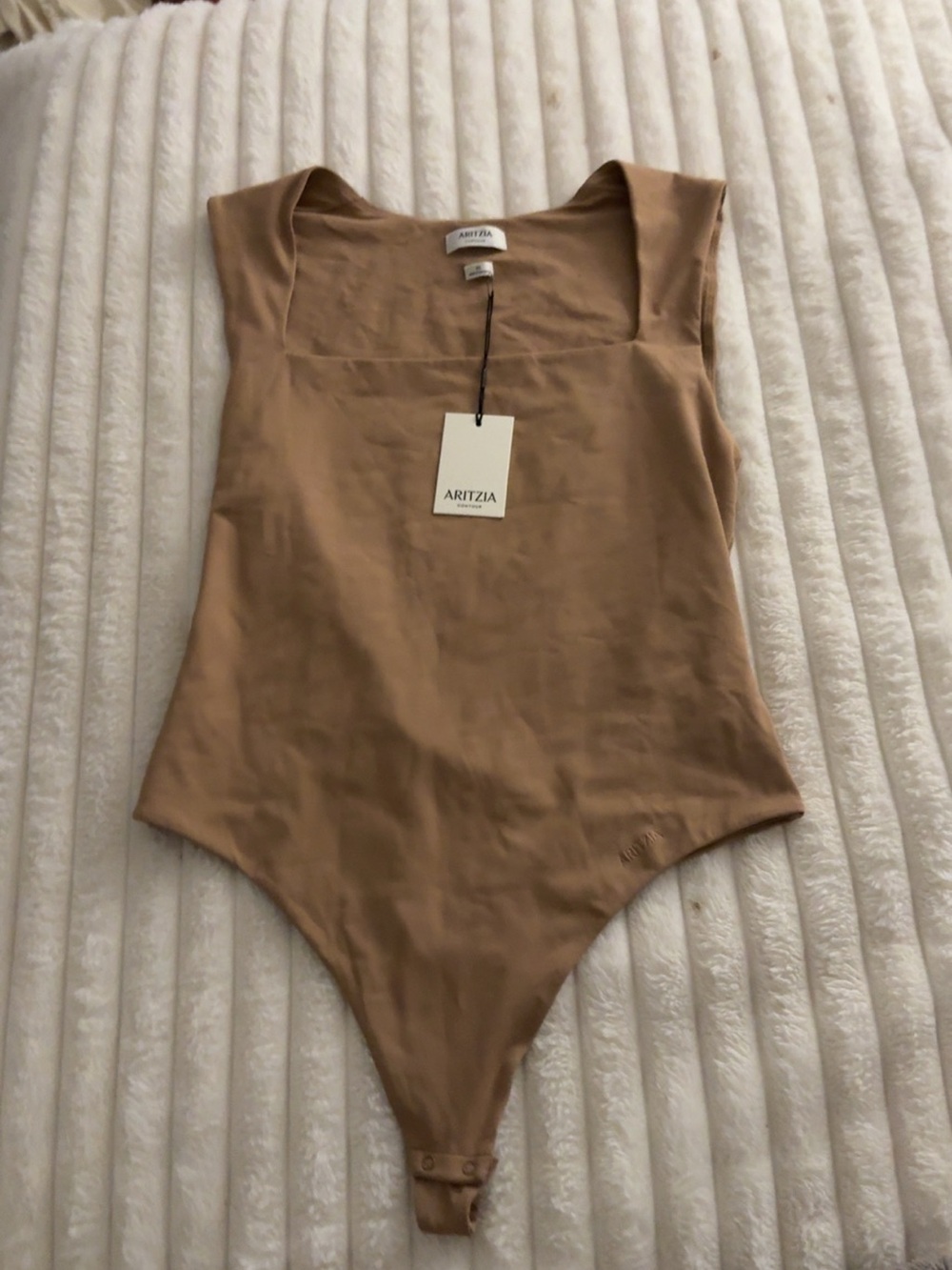 Aritzia woman’s tan One-Piece Bodysuit